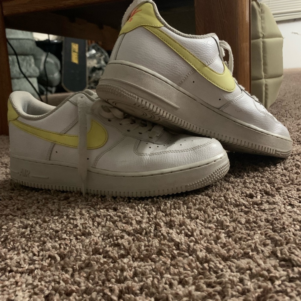 White Air Force 1’s with a Yellow Swoosh